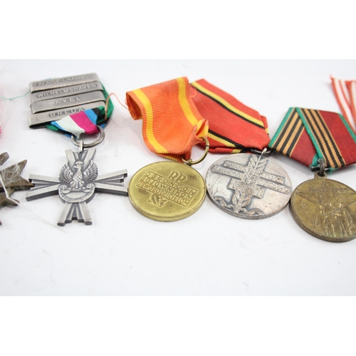 574 - Six Medals Including WW2 German Merit Cross with Swords, Polish & Russian