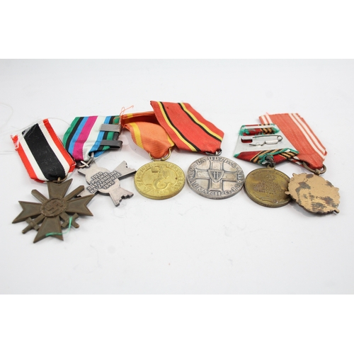 574 - Six Medals Including WW2 German Merit Cross with Swords, Polish & Russian