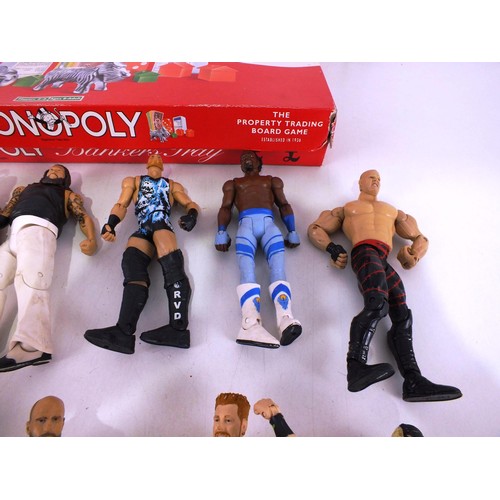 305 - Monopoly board game and assortment of wrestling figures