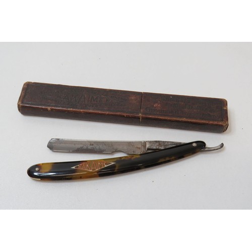 249 - Vintage Tortoiseshell cut throat razor with box.