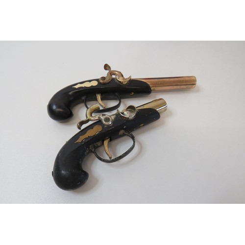 252 - Two novelty flintlock pistol lighters