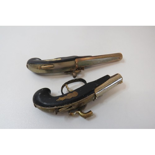 252 - Two novelty flintlock pistol lighters