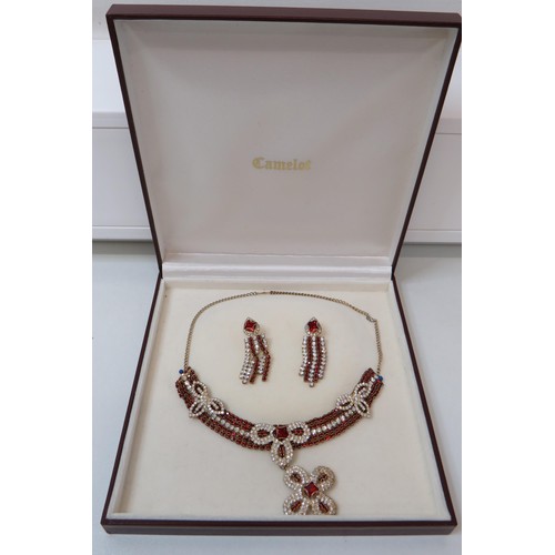 255 - Stunning boxed red and white CZ necklace and earrings set.