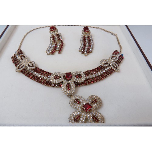 255 - Stunning boxed red and white CZ necklace and earrings set.