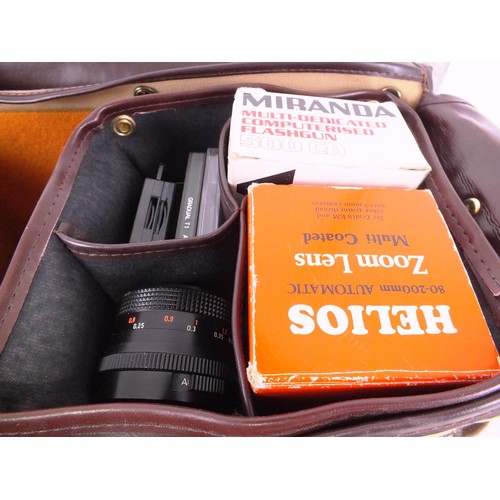 329 - Minolta camera, lens, flash and accessories in carrycase.