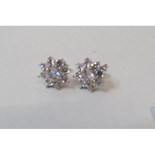 46 - Four pairs of 925 silver earrings including two pairs of Swarovski.