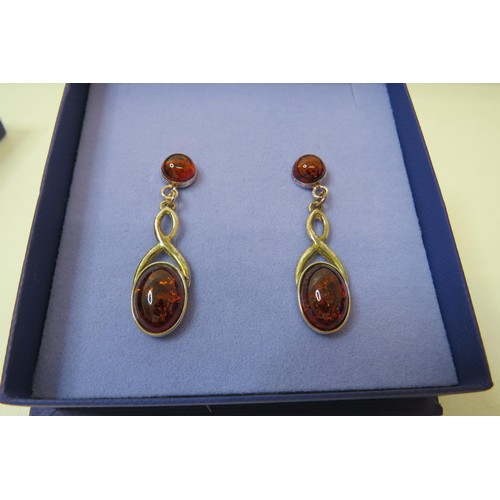 47 - Boxed Silver & Amber earrings and a boxed silver gemstone pendant necklace.