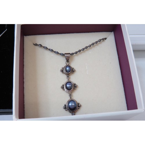 48 - Three boxed 925 silver gemstone pendant necklace's.