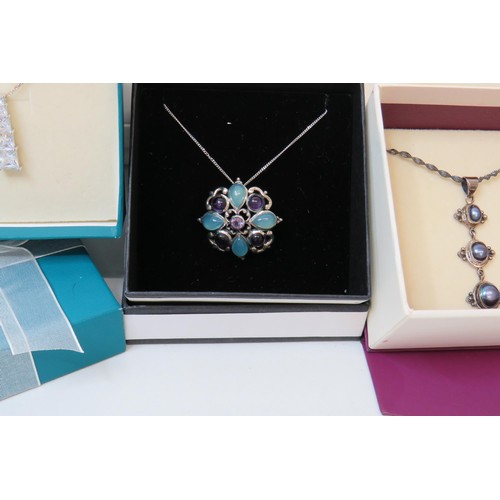 48 - Three boxed 925 silver gemstone pendant necklace's.