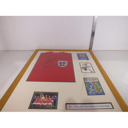 396 - Framed 1966 replica England shirt Autographed by Geoff Hurst and Martin Peters with C.O.A