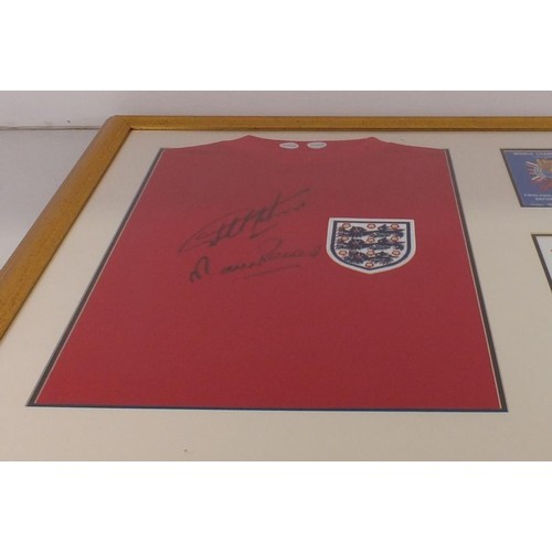 396 - Framed 1966 replica England shirt Autographed by Geoff Hurst and Martin Peters with C.O.A