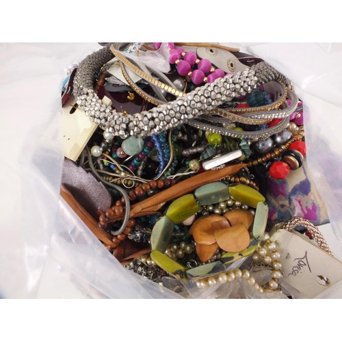 79 - 10kg of unsorted costume jewellery.