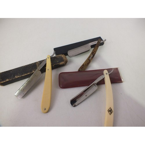 401 - Three cased cut throat razors including eye witness, Solingen and Depose