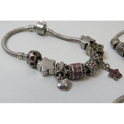 449 - Four white metal charm bracelets, 925 silver bracelet, charms to include Pandora.