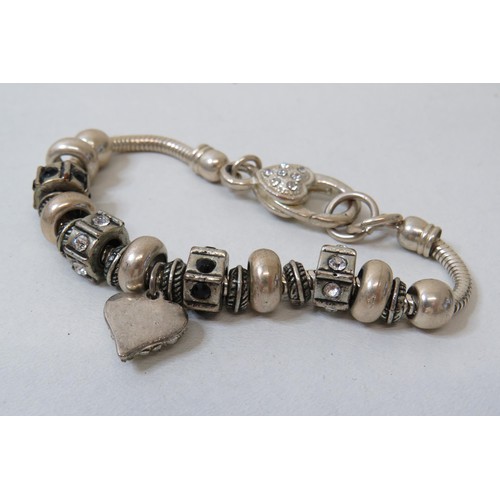 449 - Four white metal charm bracelets, 925 silver bracelet, charms to include Pandora.