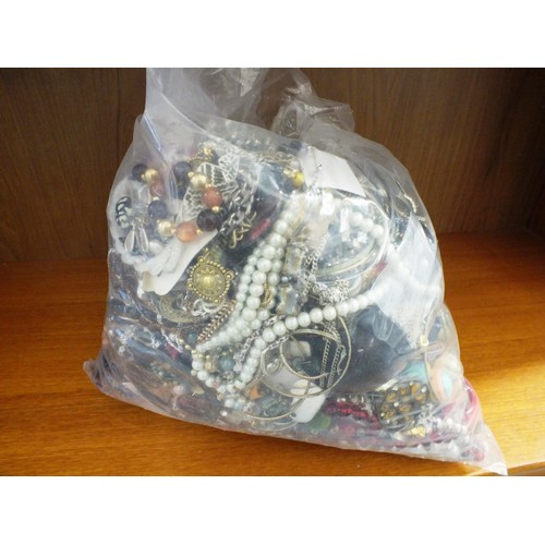 82A - 10kg bag of unsorted costume Jewellery.