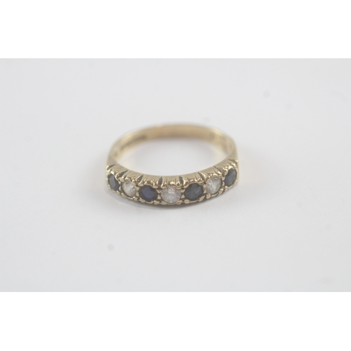 13 - 9ct gold sapphire and cubic zirconia set seven stone eternity ring (2g)- Size N