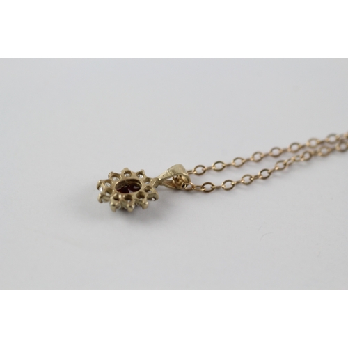 35 - 9ct gold garnet and clear gemstone halo pendant on chain (1.8g)