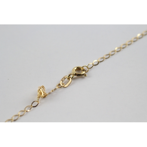 49 - 9ct gold 'charlie brown' pendant on chain (1.1g)