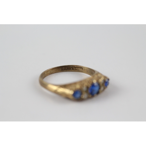 61 - 9ct gold blue and white gemstone flat setting ring (2.4g)- Size N