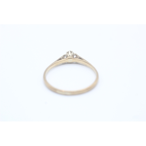 63 - 9ct gold round cut diamond solitaire dress ring (1.6g)- Size U