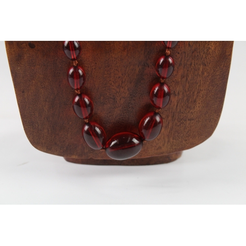 76 - Cherry Bakelite Graduated Necklace, Individually Knotted, Screw Clasp 46g