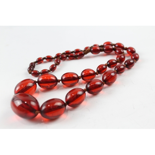 76 - Cherry Bakelite Graduated Necklace, Individually Knotted, Screw Clasp 46g