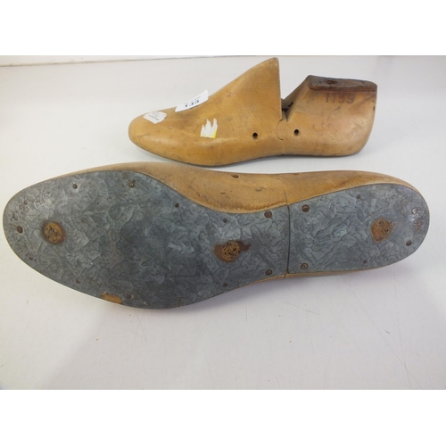 135 - Pair of wood and metal shoemakers and cobblers moulds