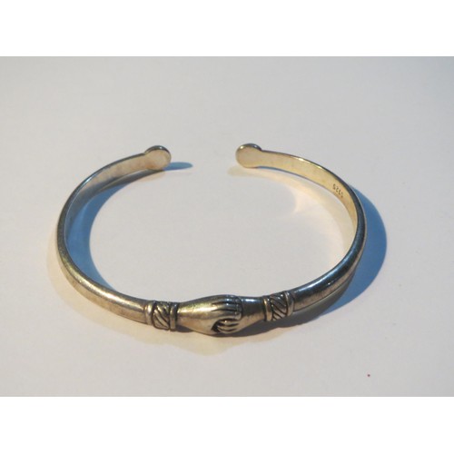 74 - S925 Sterling Silver hugging hands bangle and gold tone hugging hands bangle.