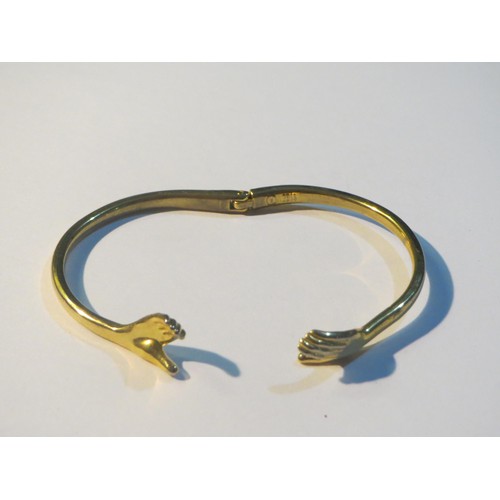 74 - S925 Sterling Silver hugging hands bangle and gold tone hugging hands bangle.