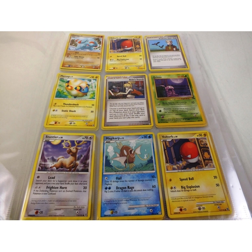 26 - Album of pokemon cards plus small number of dinosaur king