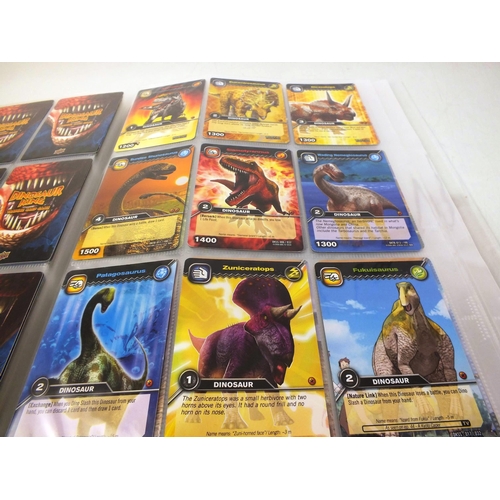 26 - Album of pokemon cards plus small number of dinosaur king