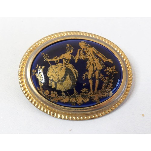 69 - Vintage Limoges France Cobalt blue and 9ct gold painted courting couple brooch.