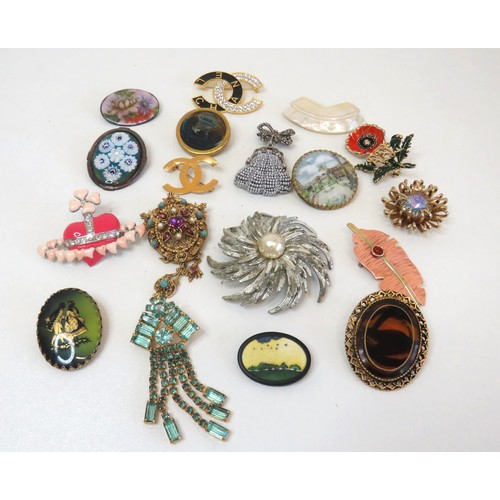 268 - Eighteen Brooches and clips including vintage crystal, hand painted porcelain etc.