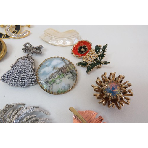 268 - Eighteen Brooches and clips including vintage crystal, hand painted porcelain etc.