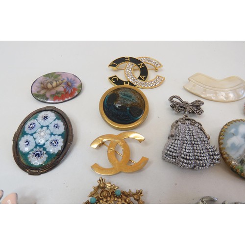 268 - Eighteen Brooches and clips including vintage crystal, hand painted porcelain etc.