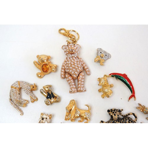 272 - Twenty three assorted brooches including dolphins, animals, teddies and a large gold tone teddy bear... 