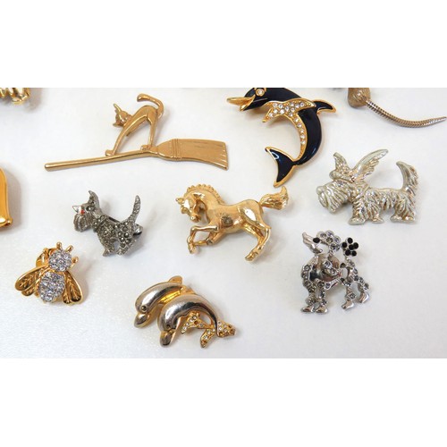 272 - Twenty three assorted brooches including dolphins, animals, teddies and a large gold tone teddy bear... 