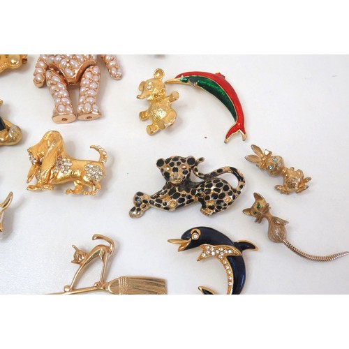 272 - Twenty three assorted brooches including dolphins, animals, teddies and a large gold tone teddy bear... 