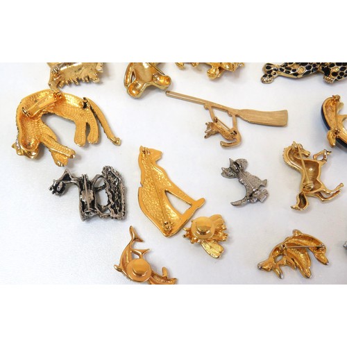 272 - Twenty three assorted brooches including dolphins, animals, teddies and a large gold tone teddy bear... 