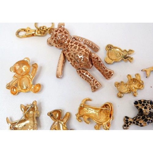 272 - Twenty three assorted brooches including dolphins, animals, teddies and a large gold tone teddy bear... 