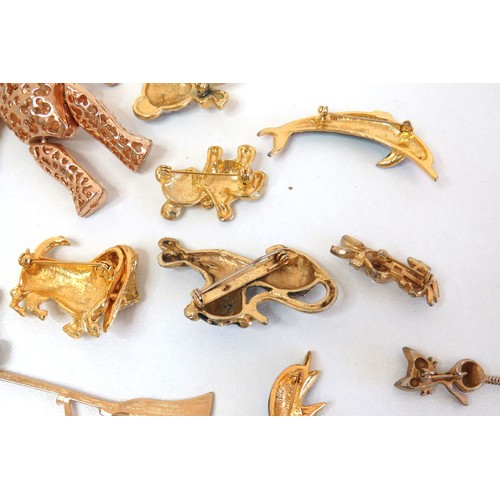 272 - Twenty three assorted brooches including dolphins, animals, teddies and a large gold tone teddy bear... 