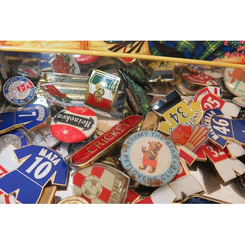 43 - 100 Badges in old tin, magpie, football, curling etc