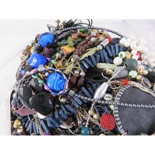 299 - 10kg bag of unsorted costume jewellery.