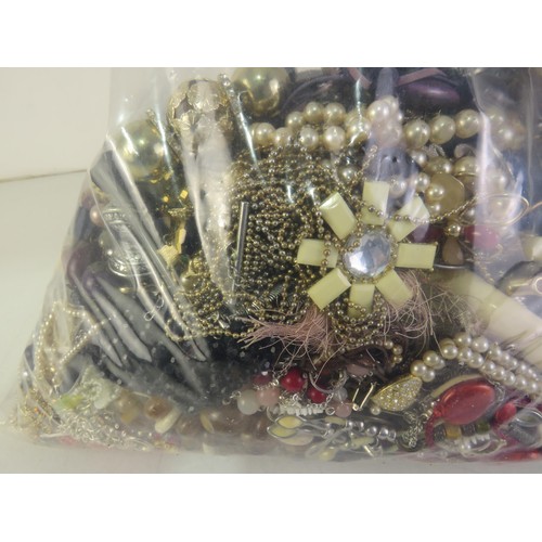 299 - 10kg bag of unsorted costume jewellery.