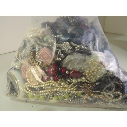 299 - 10kg bag of unsorted costume jewellery.