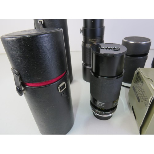 278 - Four camera lens including Boxed Canon FD Zoom and Auto Super Travenar.