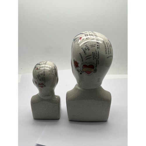 191 - Two phrenology heads.