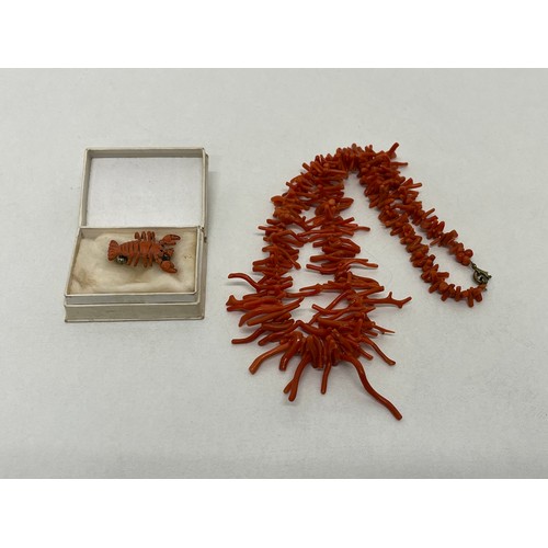 27 - Vintage carved coral lobster brooch and coral branch necklace.