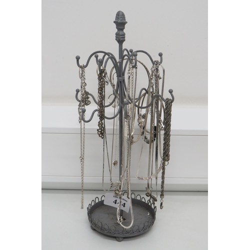 444 - Silver jewellery on stand